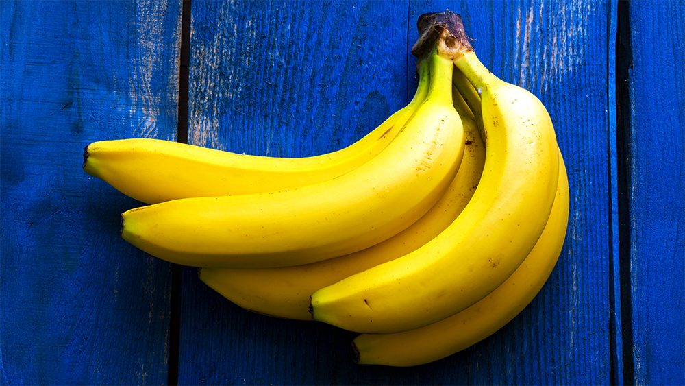 Bananas on a blue wooden table – a simple way to lift your mood