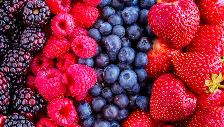 a group of berries and strawberries