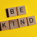 Wooden blocks with letters spelling out -Be Kind