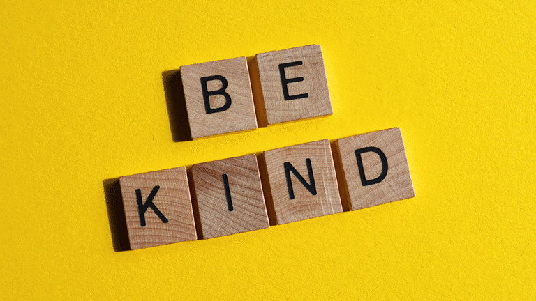 Wooden blocks with letters spelling out -Be Kind