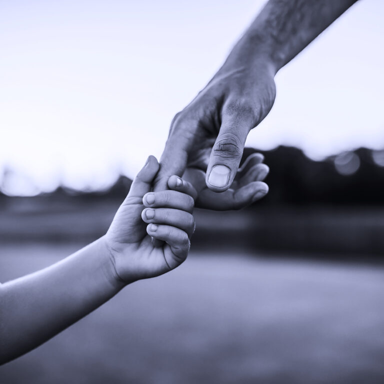 Little child holding Dad's finger