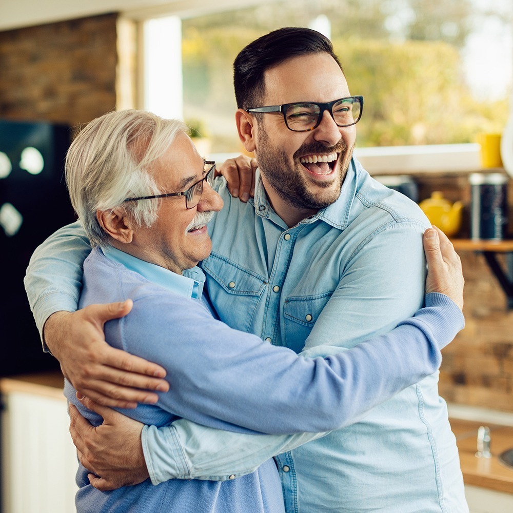 Dad and son hugging with happiness and joy. Dad love