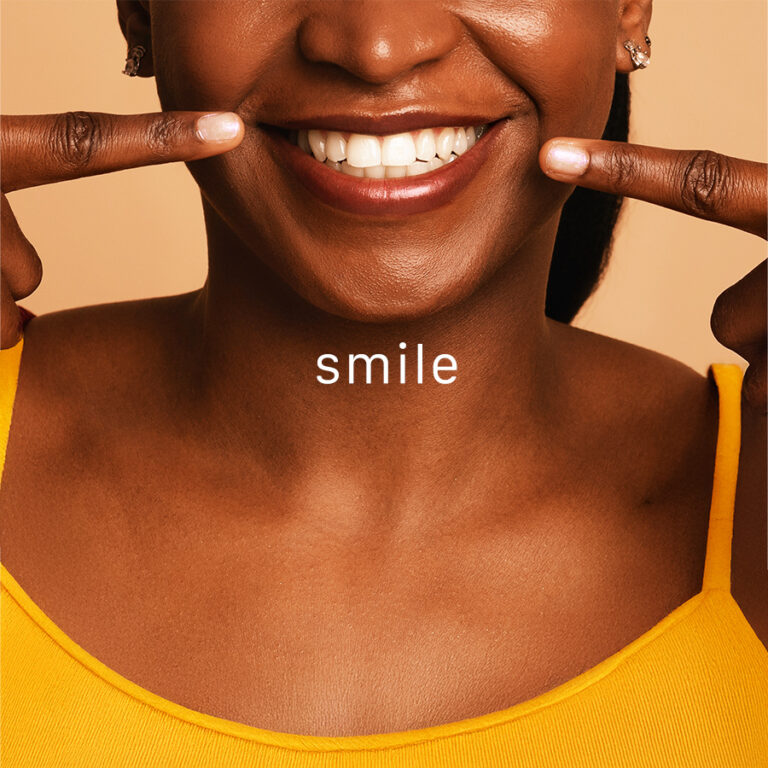 Benefits of Smiling. Young woman showing a genuine smile.