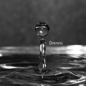 A water droplet enter the pool of water below representing the universal law of oneness.