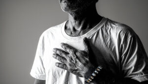 Man with hand on chest at peace -Spiritual Habits