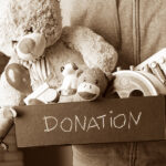 Benefits of Kindness - Person donating a box of toys.